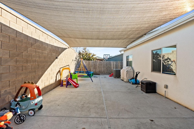 view of patio with a playground