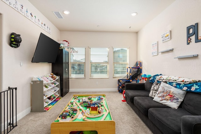 game room with light carpet