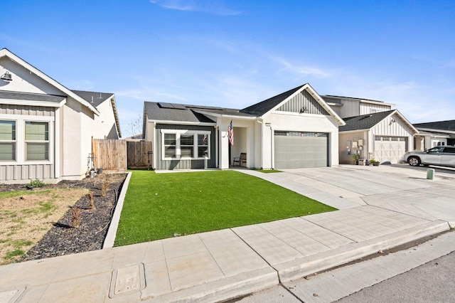 view of front of home with a garage and a front yard