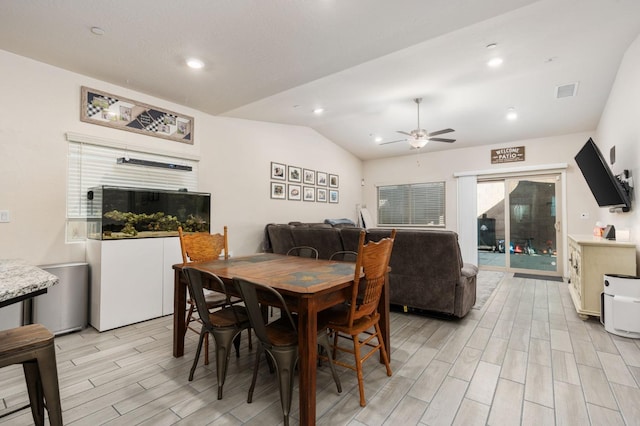 dining area featuring vaulted ceiling and ceiling fan