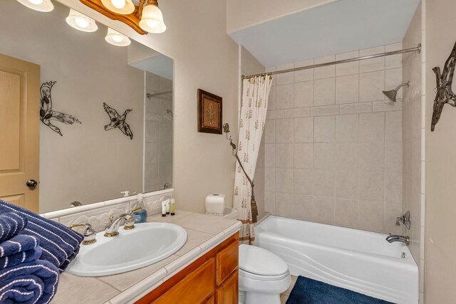 full bathroom featuring vanity, toilet, and shower / bath combo with shower curtain