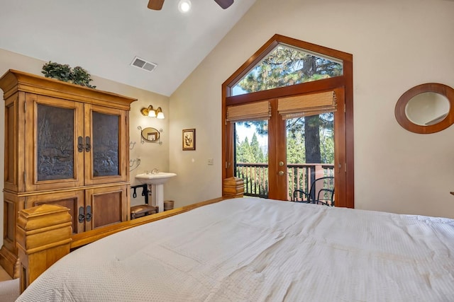 bedroom featuring ceiling fan, vaulted ceiling, and access to outside