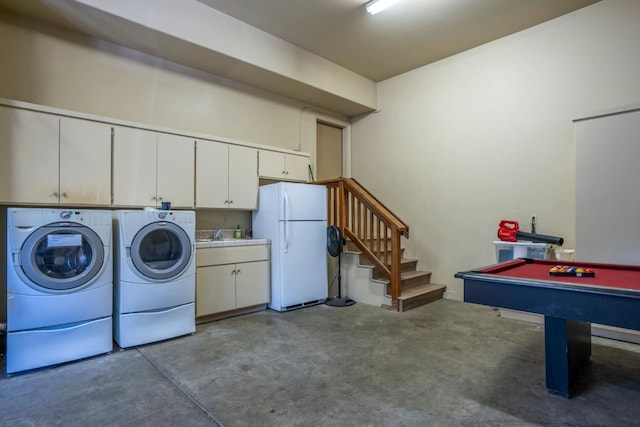 laundry room featuring cabinets, independent washer and dryer, and pool table