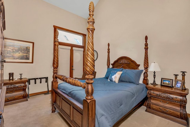 carpeted bedroom featuring vaulted ceiling