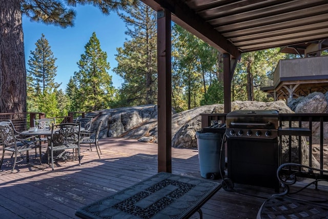 wooden terrace with area for grilling