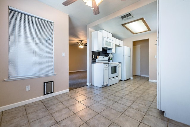 kitchen featuring a ceiling fan, white appliances, visible vents, and white cabinetry