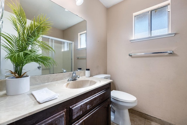 full bath featuring toilet, a shower stall, tile patterned flooring, and vanity