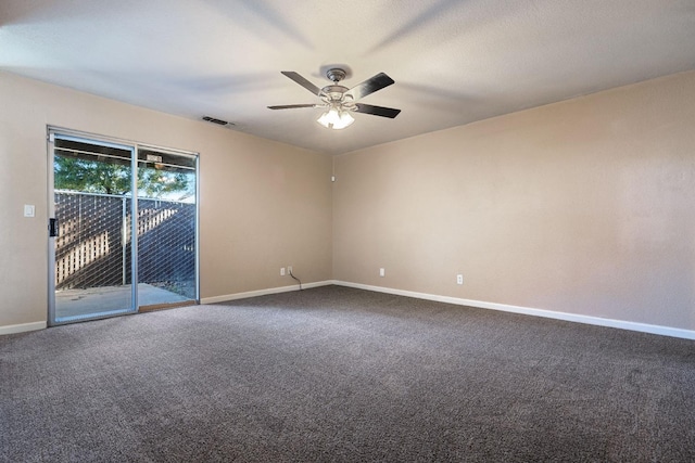 carpeted empty room with ceiling fan, visible vents, and baseboards