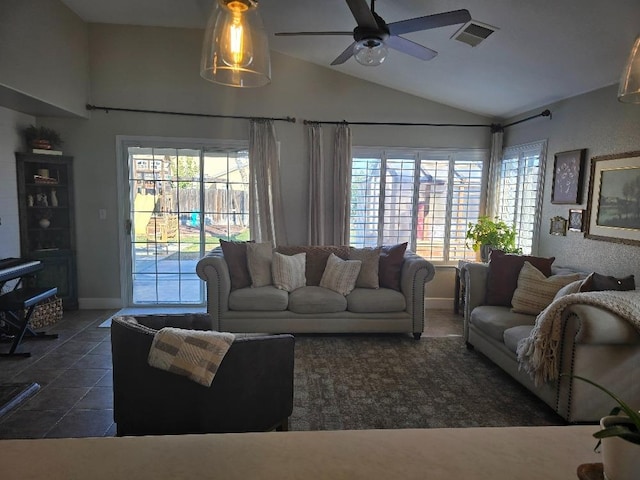 living room with ceiling fan, plenty of natural light, and vaulted ceiling