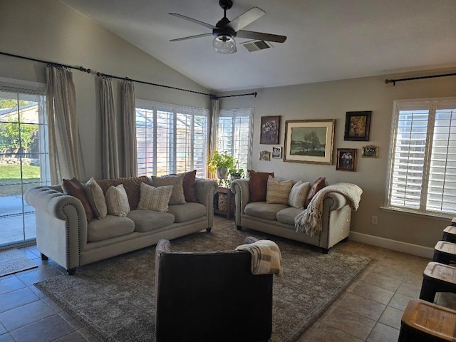 living room with ceiling fan, tile patterned flooring, vaulted ceiling, and a wealth of natural light