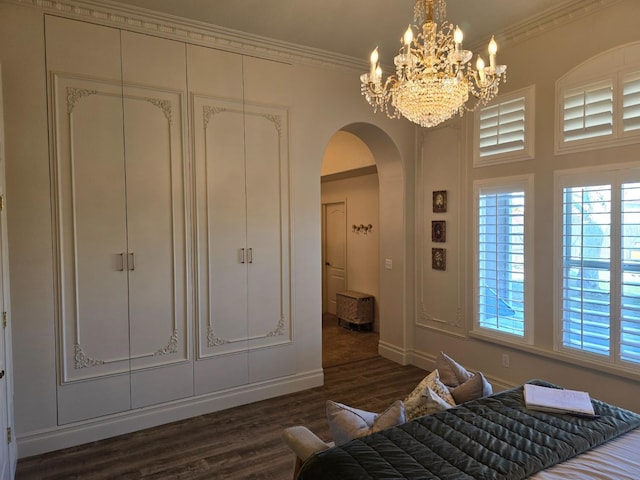 bedroom featuring ornamental molding and dark wood-type flooring