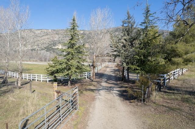 mountain view featuring a rural view