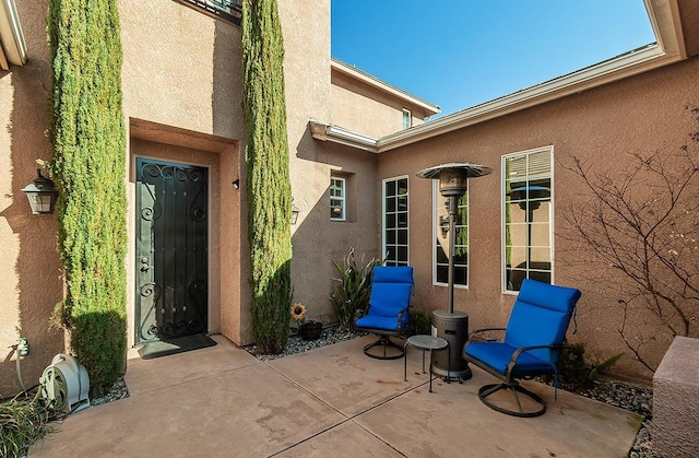 property entrance with a patio area