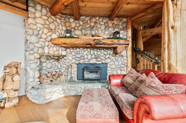 living room with beam ceiling, wood-type flooring, and wooden ceiling