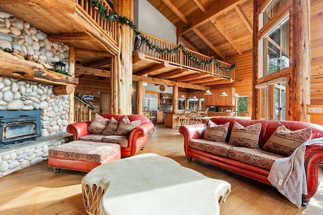 living room featuring wooden ceiling, wooden walls, hardwood / wood-style flooring, and beamed ceiling