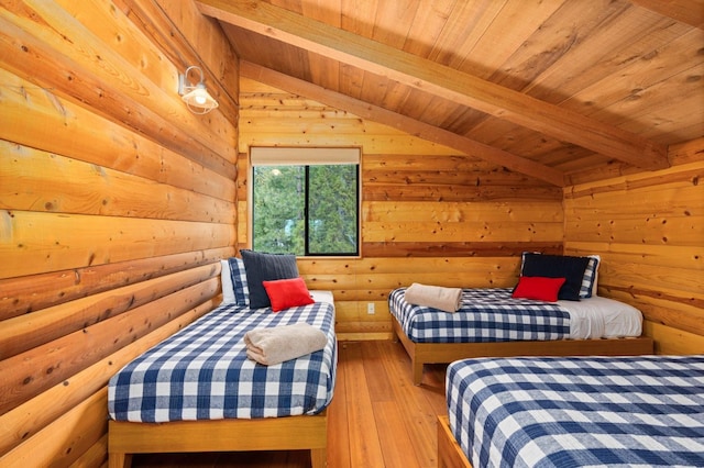 bedroom with wood ceiling, lofted ceiling with beams, light hardwood / wood-style floors, and wood walls