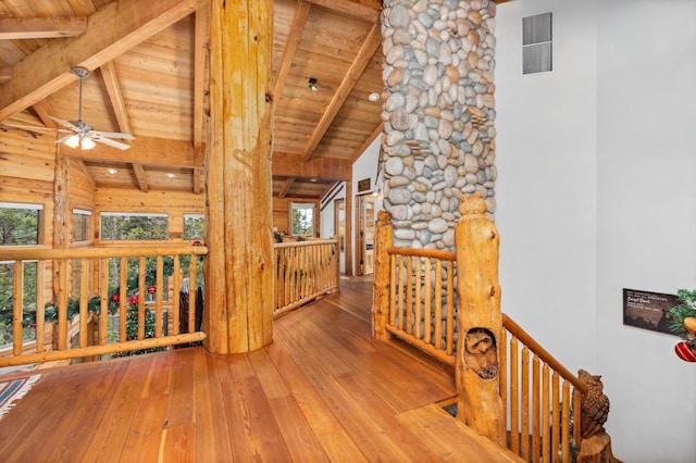 hall featuring hardwood / wood-style floors, wood ceiling, high vaulted ceiling, and beamed ceiling