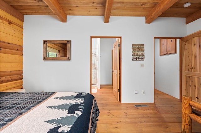 bedroom featuring wood ceiling, beam ceiling, and light hardwood / wood-style flooring