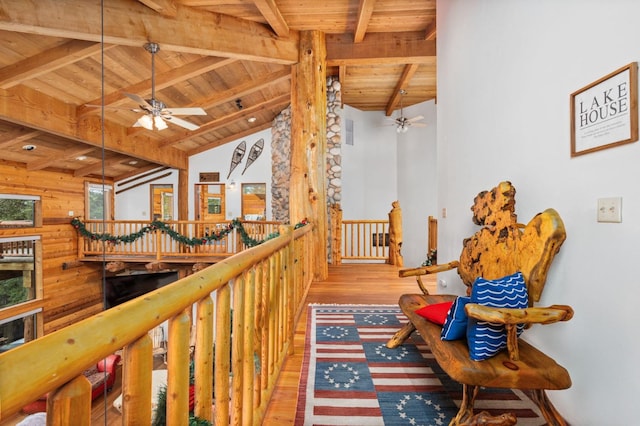 corridor with wood ceiling, beam ceiling, high vaulted ceiling, and light wood-type flooring