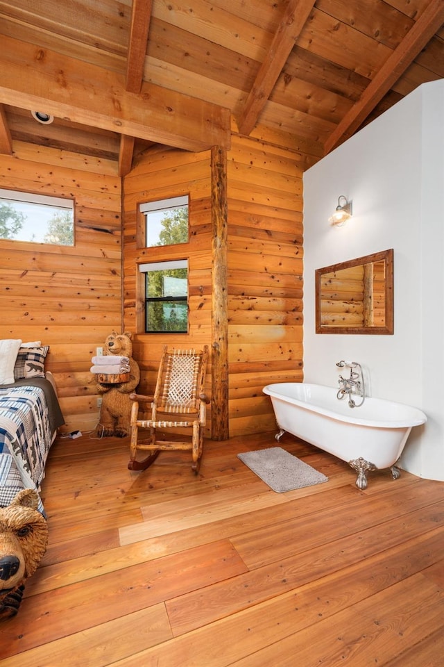 bathroom featuring a tub to relax in, hardwood / wood-style floors, wooden ceiling, and rustic walls