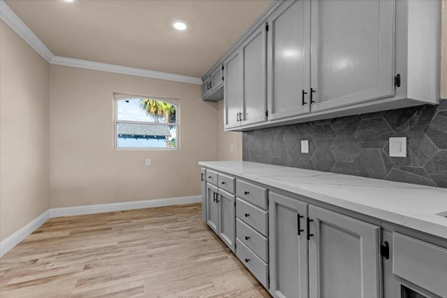 4491 E Nevada Ave, Fresno, CA 93702 - clothes washing area featuring crown molding and light hardwood / wood-style floors