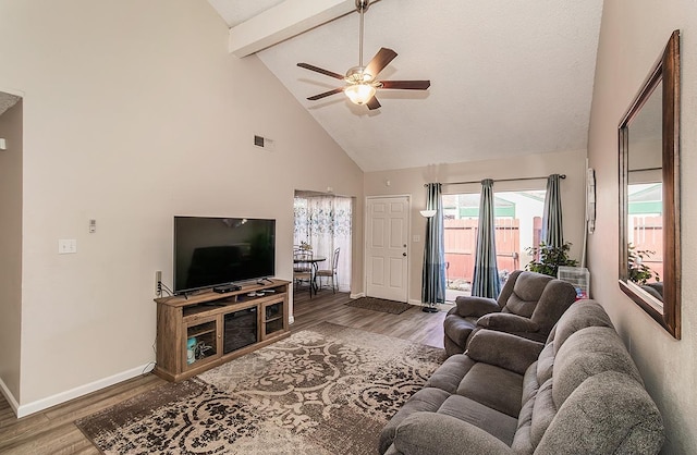 living room with beamed ceiling, wood-type flooring, ceiling fan, and high vaulted ceiling