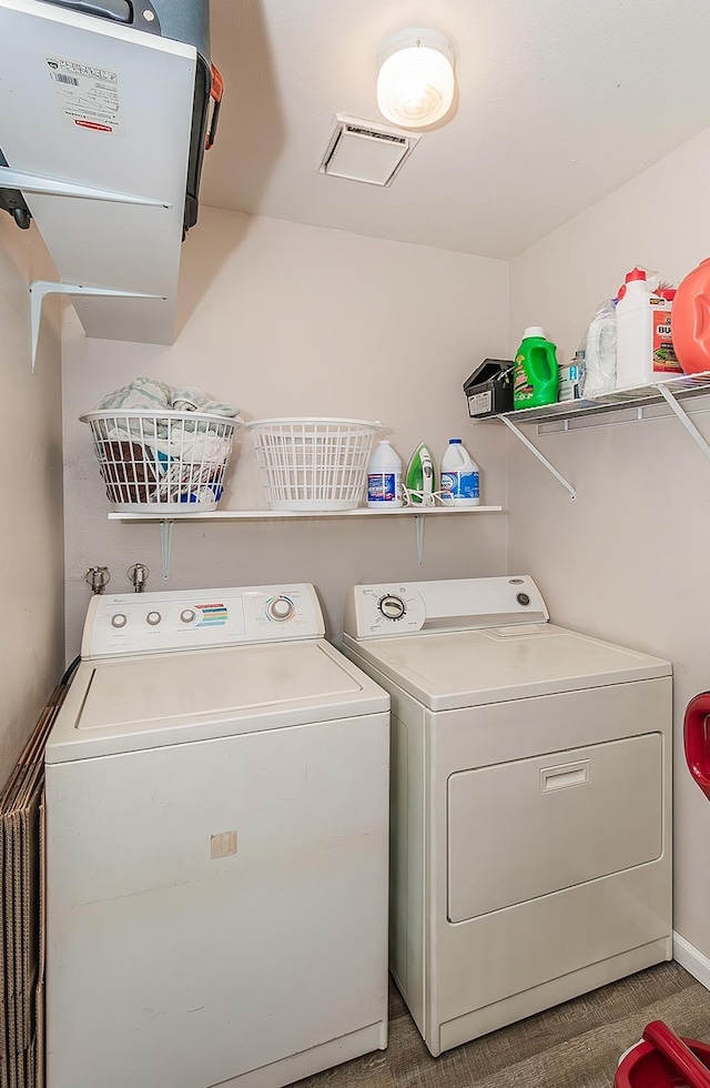 laundry area featuring separate washer and dryer