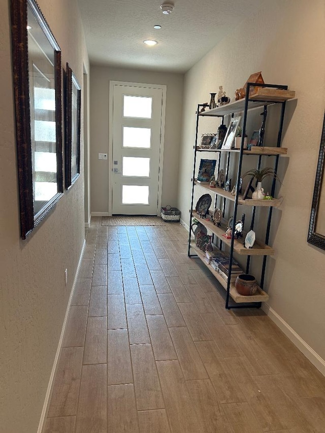 doorway to outside with light hardwood / wood-style floors