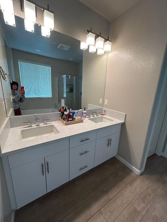 bathroom with vanity and an enclosed shower