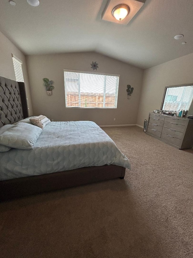 carpeted bedroom with vaulted ceiling