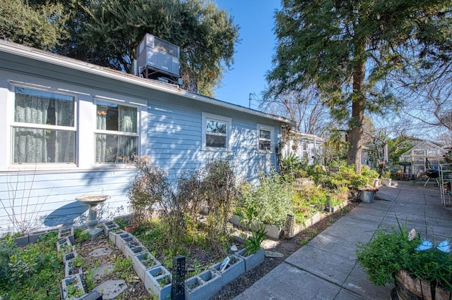 view of side of property with a patio area