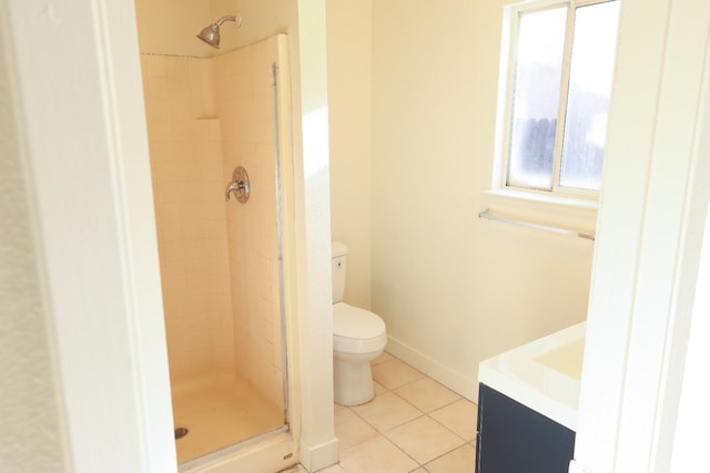 5140 E Belgravia Ave, Fresno, CA 93725 - bathroom with tile patterned flooring, a shower stall, toilet, and vanity