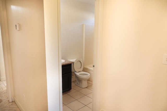 5140 E Belgravia Ave, Fresno, CA 93725 - full bath with tile patterned floors, vanity, toilet, and  shower combination