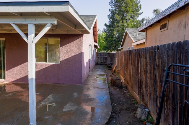 5140 E Belgravia Ave, Fresno, CA 93725 - view of property exterior with stucco siding and a patio