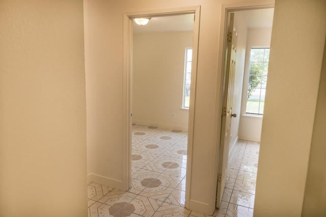 5140 E Belgravia Ave, Fresno, CA 93725 - hallway featuring baseboards and light tile patterned flooring