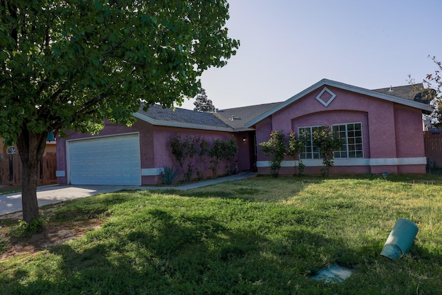 5140 E Belgravia Ave, Fresno, CA 93725 - ranch-style house featuring an attached garage, stucco siding, and concrete driveway