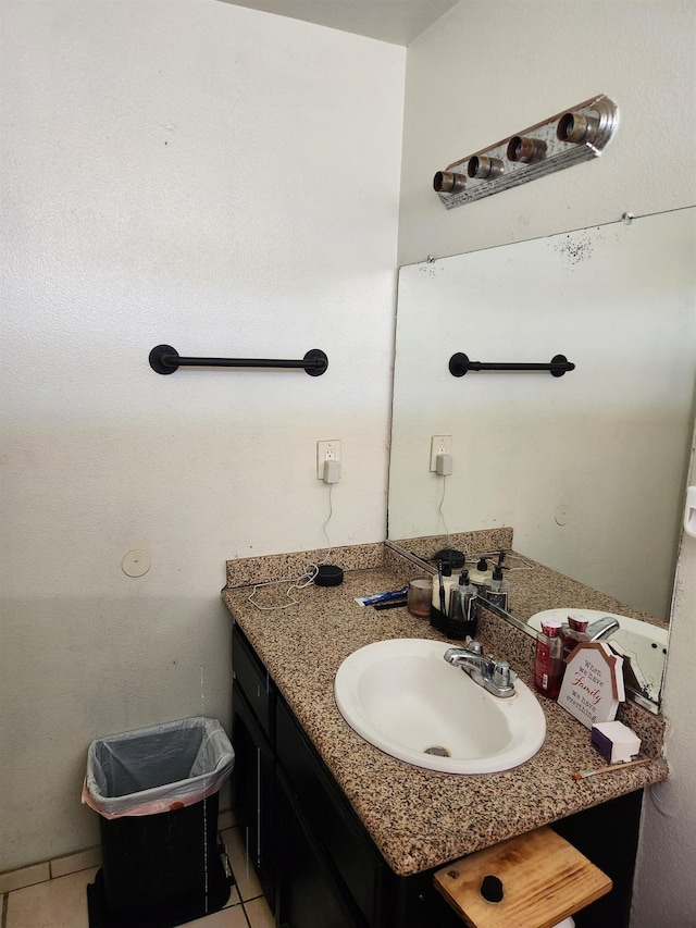 bathroom with tile patterned flooring and vanity