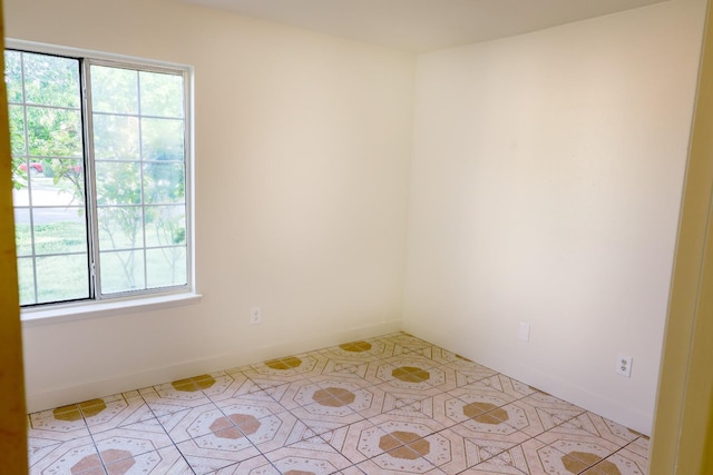 5140 E Belgravia Ave, Fresno, CA 93725 - unfurnished room featuring light tile patterned flooring and baseboards