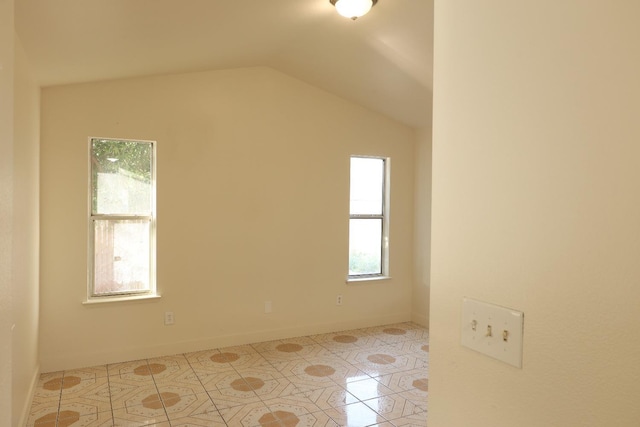 5140 E Belgravia Ave, Fresno, CA 93725 - unfurnished room featuring healthy amount of natural light, lofted ceiling, and baseboards