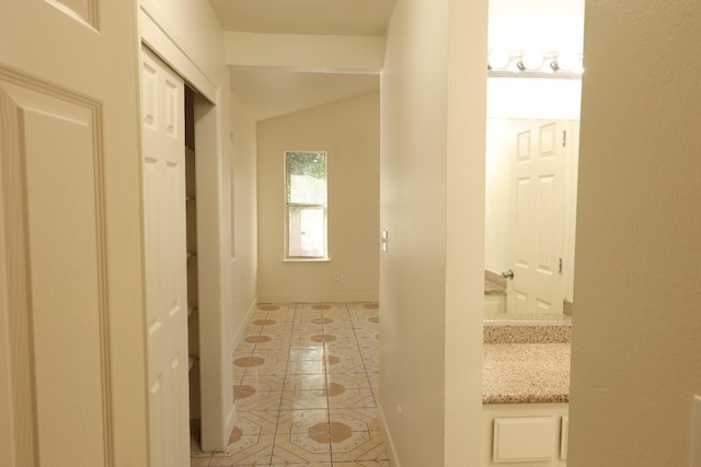5140 E Belgravia Ave, Fresno, CA 93725 - corridor with light tile patterned flooring and vaulted ceiling