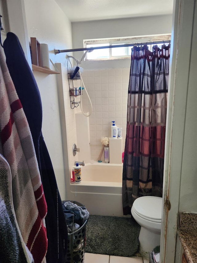 bathroom with shower / tub combo and toilet