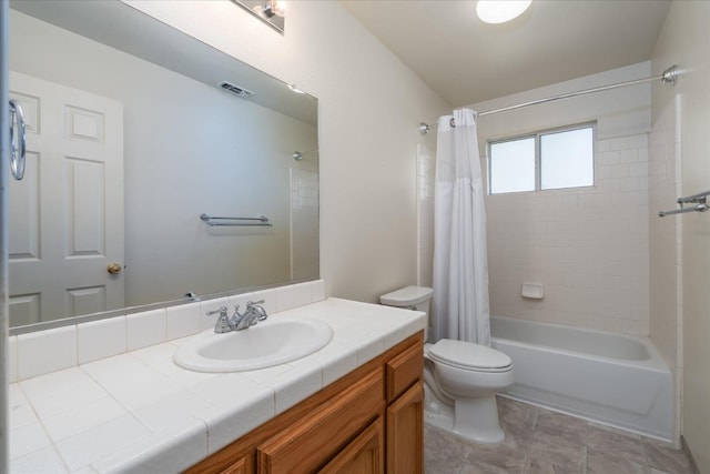 full bathroom with vanity, shower / bath combo, and toilet