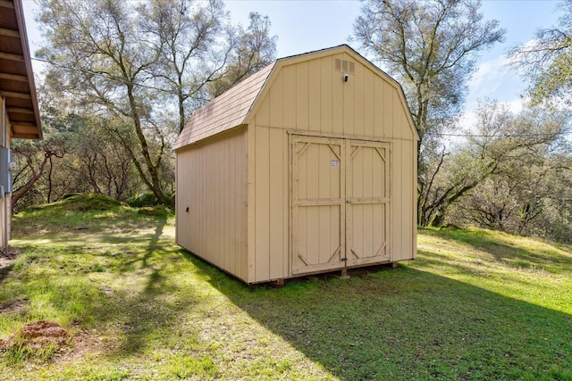 view of outdoor structure with a lawn