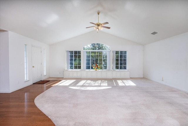 unfurnished living room with light hardwood / wood-style flooring, high vaulted ceiling, and ceiling fan