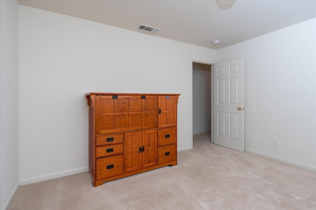 bedroom featuring light colored carpet