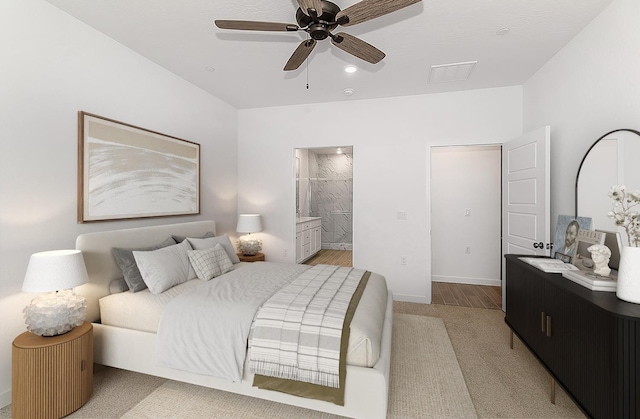 bedroom with ensuite bathroom and ceiling fan