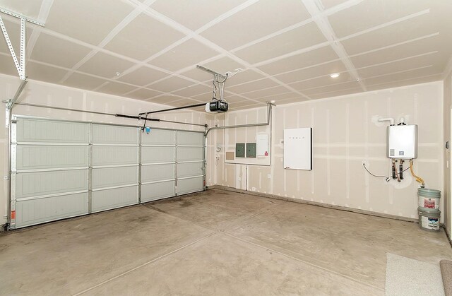 garage featuring a garage door opener, electric panel, and tankless water heater