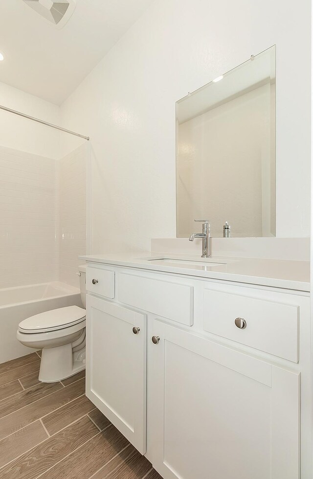 full bathroom featuring vanity, shower / washtub combination, and toilet