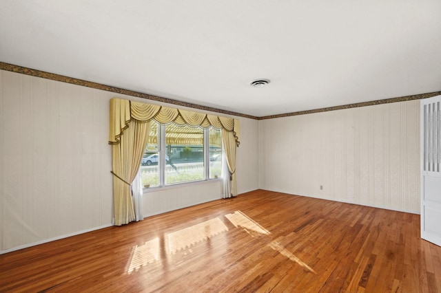 empty room with wood-type flooring