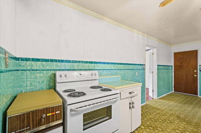 kitchen featuring tile walls, white electric range, ornamental molding, and white cabinets